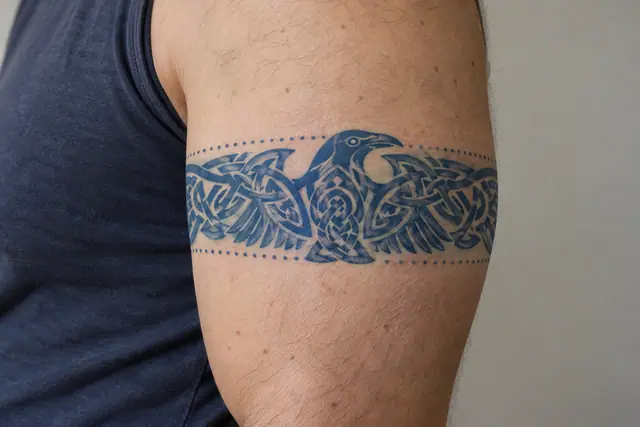 Woad blue Celtic animal tattoo on the arm (armband)