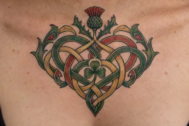 Color illuminated Celtic motherhood knot tattoo on the chest